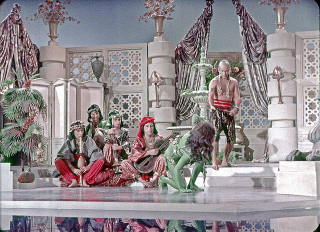 Illustration for article titled Rare Star Trek photos show green Orion slavegirls like you've never seen them